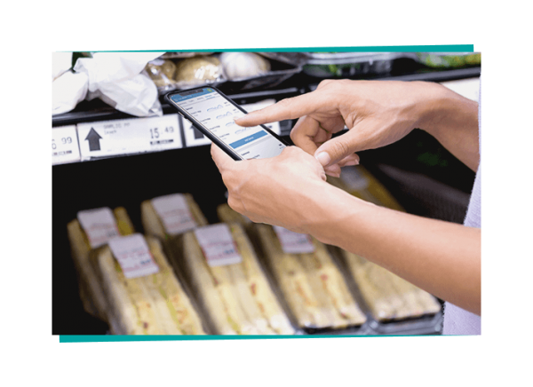 employee checking prepped food shelves