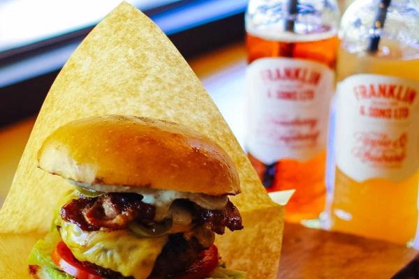 Burger and drinks on counter