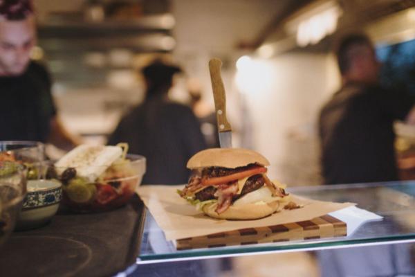 Burger with knife ready to be served