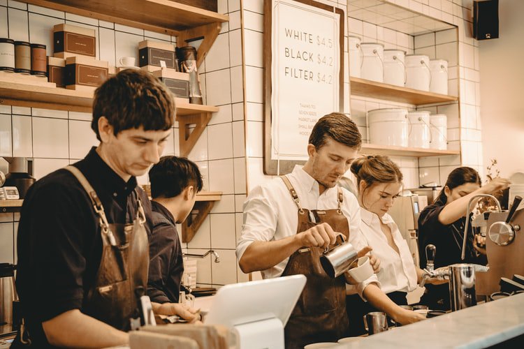 foodservice workers behind a counter