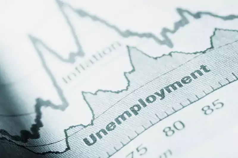 Folded sheet of paper with an unemployment graph on